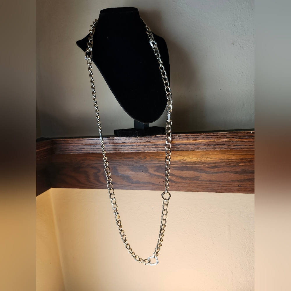 Long silver tone necklace with squares of rhinestones. Very sparkly! Tag  Nicole